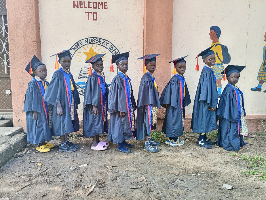 Star of Hope nursery graduates in their gowns